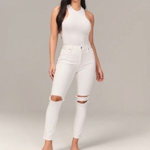 Abercrombie super skinny high rise ripped white jeans.
